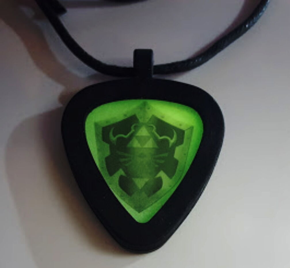 Legend Of Zelda Hylian Shield Glow In The Dark Pickbandz Guitar Pick Necklace