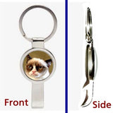 A Grumpy Cat Pennant or Keychain silver tone secret bottle opener no tard